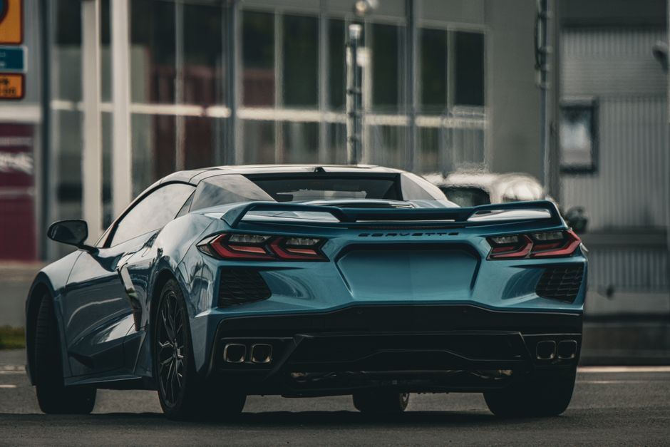 Rear view of a blue Corvette sports car parked outdoors in Jönköping, Sweden.